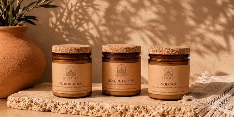 Three Aromas Aztecas soy candles featuring Bosque de Piña, Flor de Nopal, and Volcán displayed with terracotta pottery and warm earthy décor.
