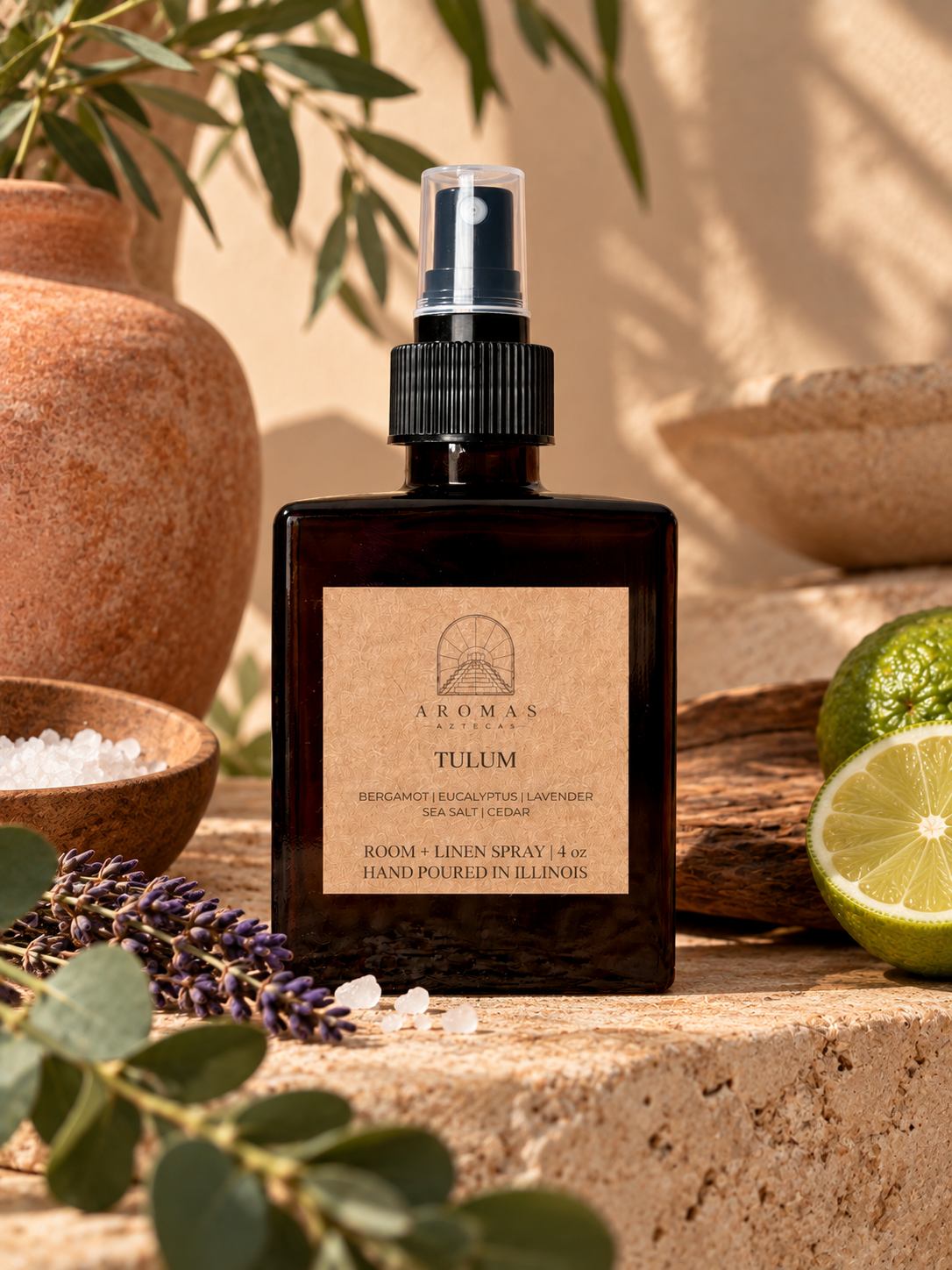 Aromas Aztecas Tulum room + linen spray in an earthy, sunlit setting with lavender, eucalyptus, sea salt, citrus, wood, and terracotta accents.