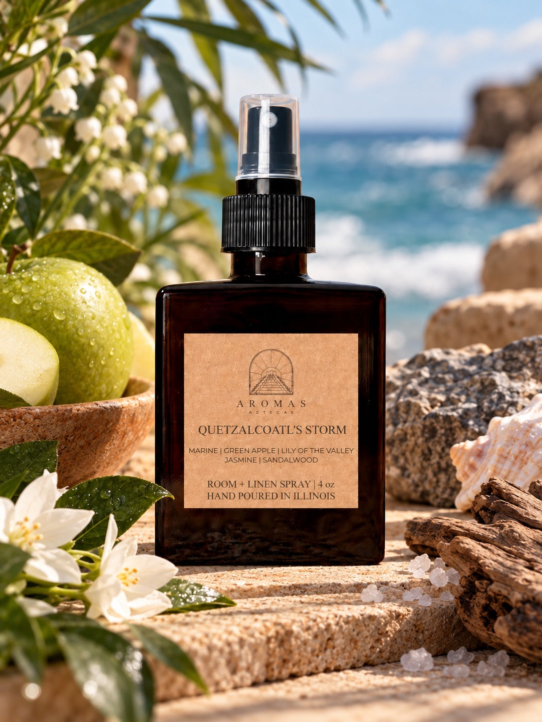 Aromas Aztecas Quetzalcoatl’s Storm room and linen spray surrounded by green apple, jasmine, lily of the valley, sea-inspired elements, and driftwood.